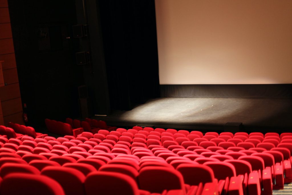 red chairs in front of white projector screen