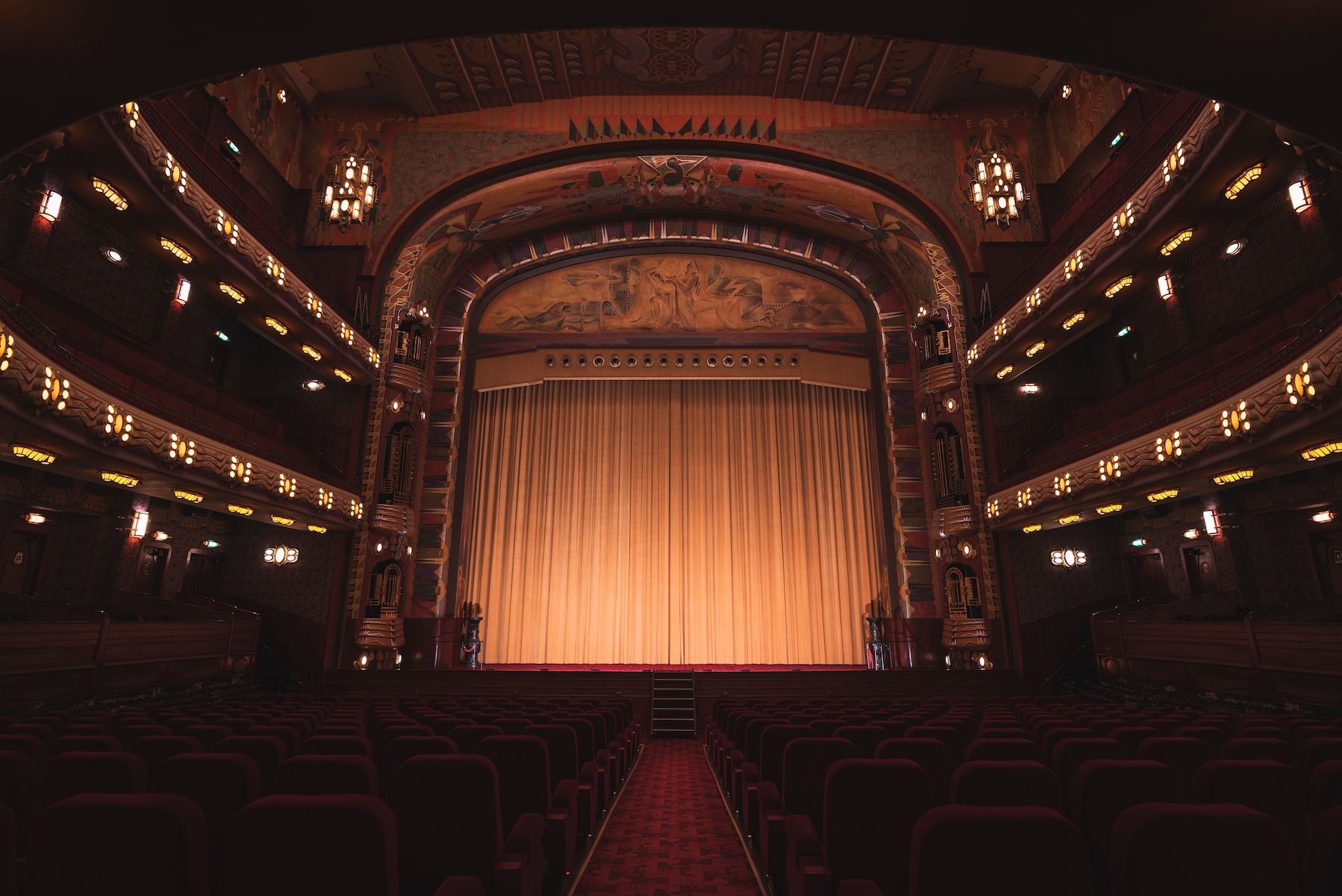 brown wooden chairs inside theater